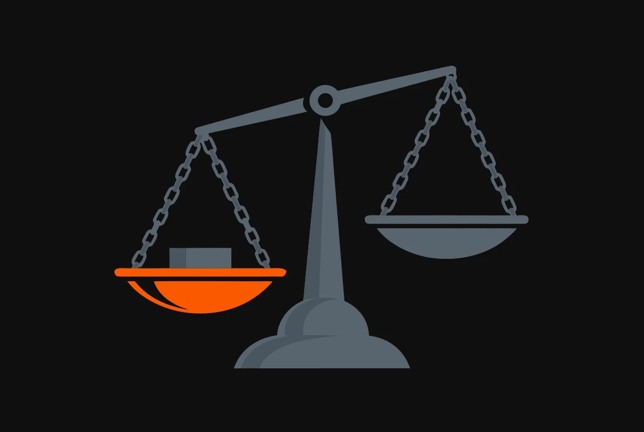 A two-pan balance scale, one pan weighed down and coloured orange, the other empty and tipped up.